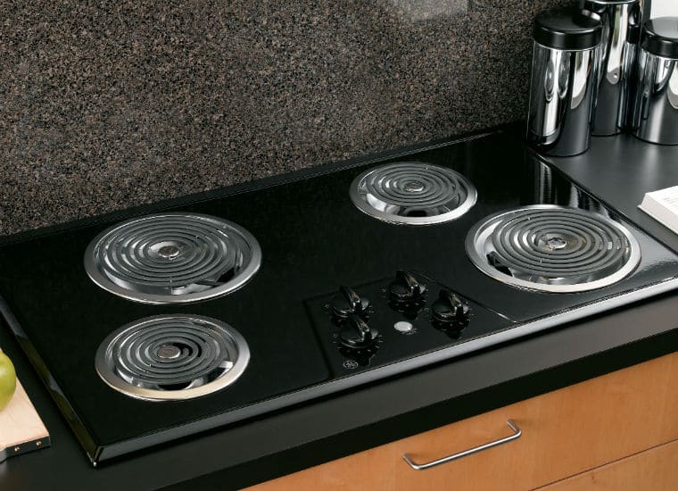 Electric cooktop surface scratched or pitted